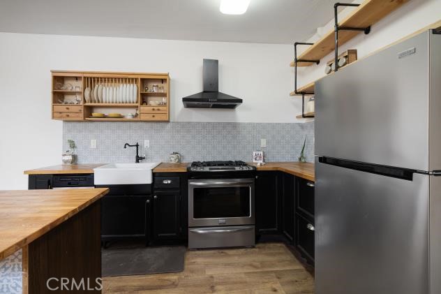 624 Corte Patio, Unit 81 Chula Vista, CA 91914 - Photo 13 of 35 a kitchen with stainless steel appliances a stove and a refrigerator