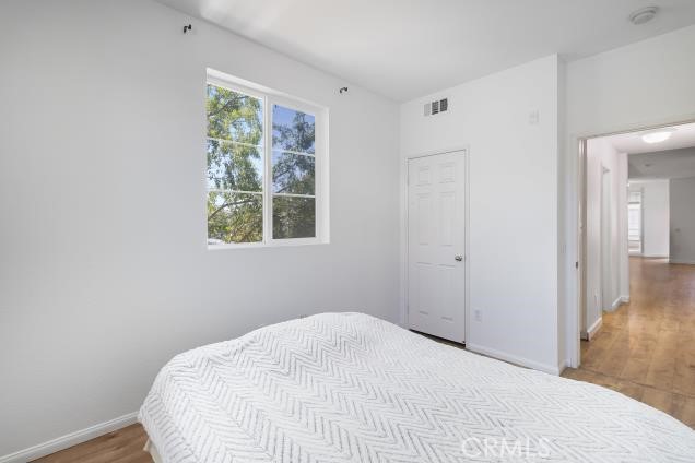 624 Corte Patio, Unit 81 Chula Vista, CA 91914 - Photo 16 of 35 a bedroom with a bed and a window