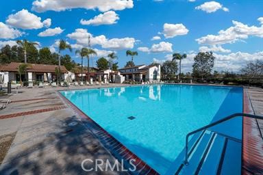 624 Corte Patio, Unit 81 Chula Vista, CA 91914 - Photo 2 of 35 a view of a swimming pool with outdoor seating