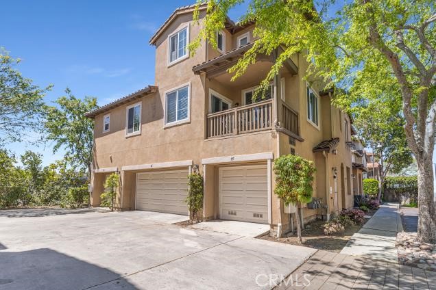 624 Corte Patio, Unit 81 Chula Vista, CA 91914 - Photo 22 of 35 a front view of a house with a garden