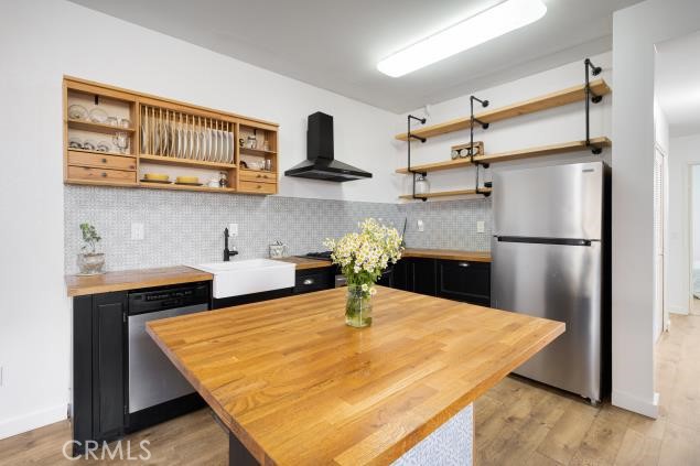 624 Corte Patio, Unit 81 Chula Vista, CA 91914 - Photo 33 of 35 a kitchen with stainless steel appliances granite countertop a refrigerator a sink and white cabinets