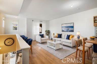 624 Corte Patio, Unit 81 Chula Vista, CA 91914 - Photo 8 of 35 a living room with furniture and a clock