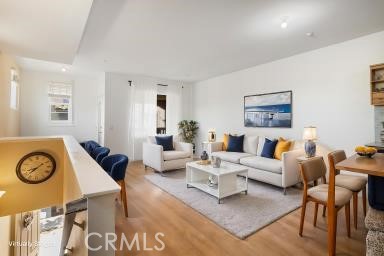 624 Corte Patio, Unit 81 Chula Vista, CA 91914 - Photo 9 of 35 a living room with furniture a clock on wall and a window