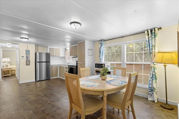 a view of a dining room with furniture and a livingroom