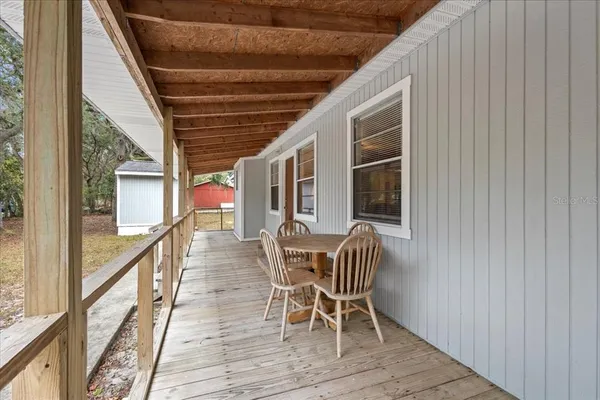 a outdoor space with wooden floor and furniture