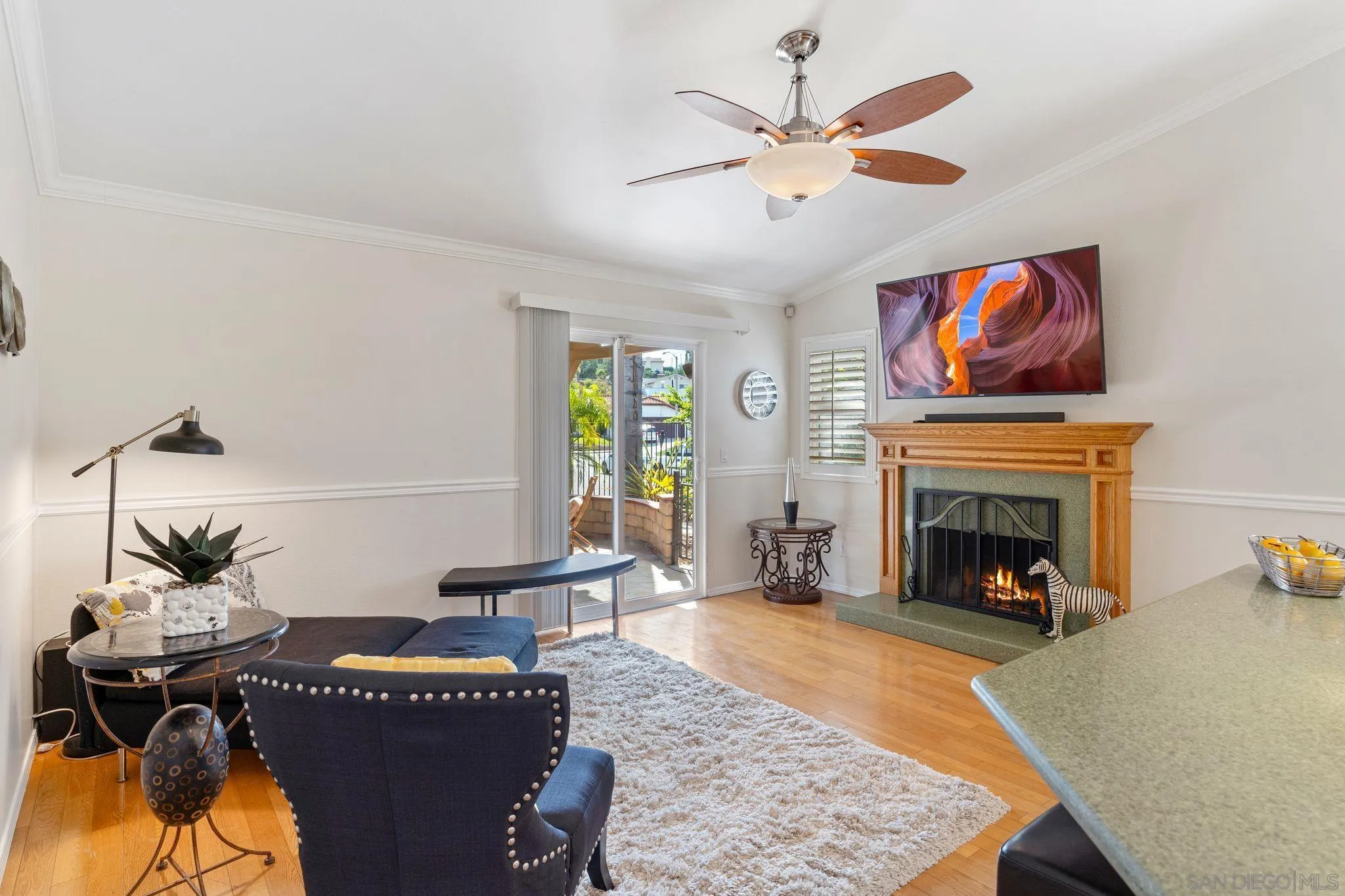 3533 Oakleaf Court Spring Valley, CA 91977 - Photo 13 of 38 a living room with furniture a fireplace and window