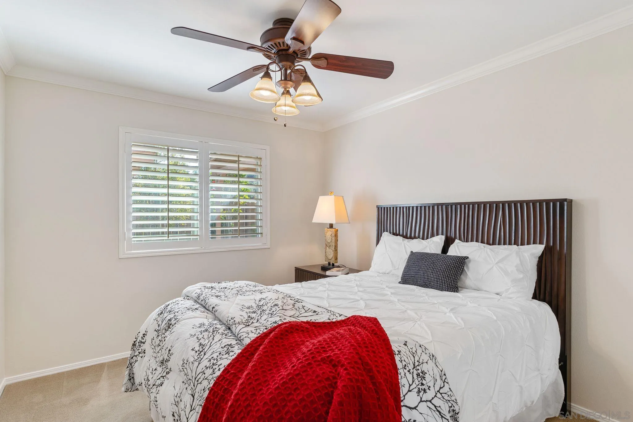 3533 Oakleaf Court Spring Valley, CA 91977 - Photo 16 of 38 a bedroom with a bed and a chandelier