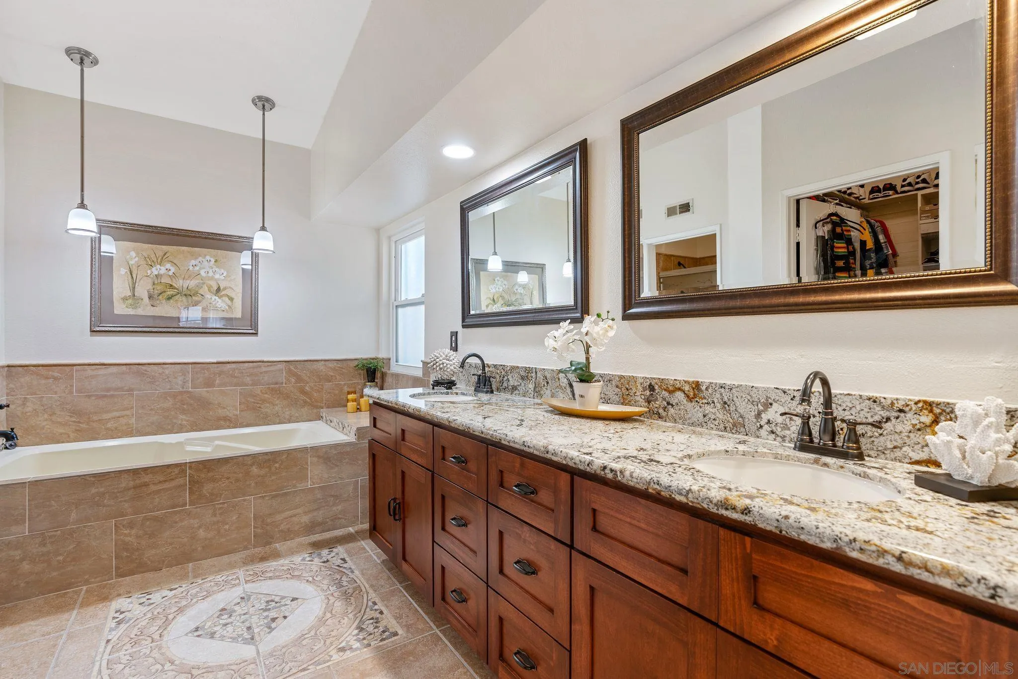 3533 Oakleaf Court Spring Valley, CA 91977 - Photo 21 of 38 a bathroom with a granite countertop sink mirror and bathtub