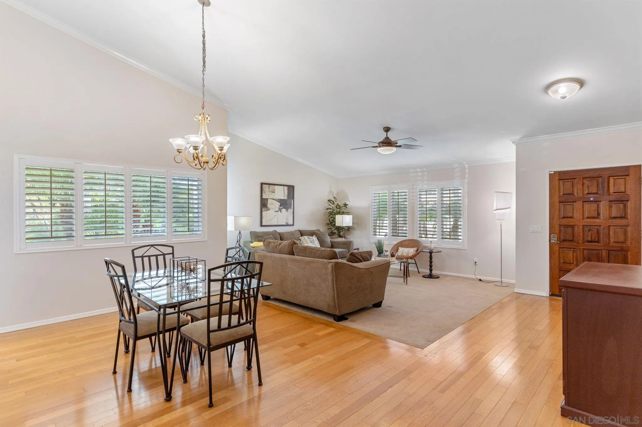 3533 Oakleaf Court Spring Valley, CA 91977 - Photo 7 of 38 a view of a dining room with furniture wooden floor and chandelier