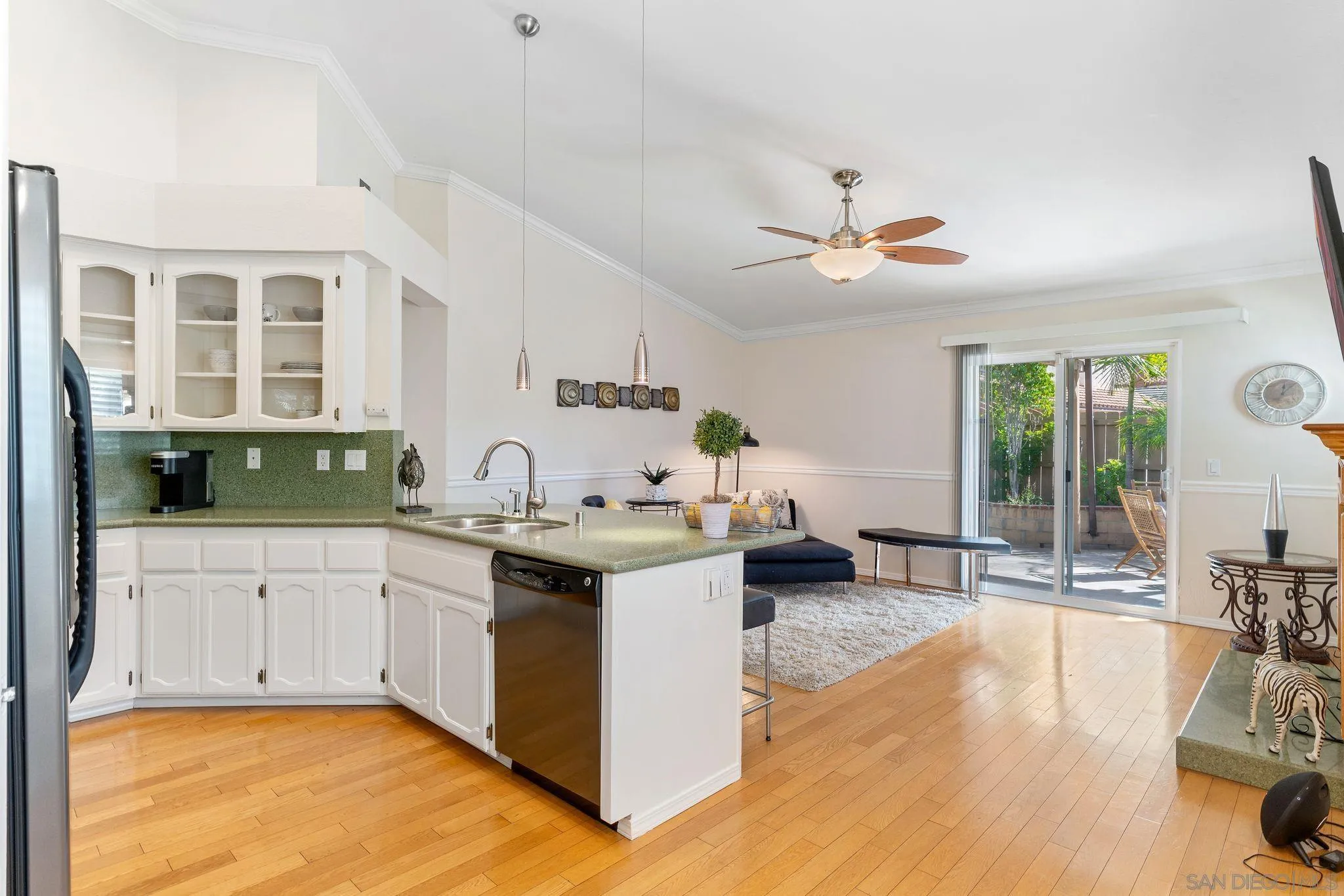 3533 Oakleaf Court Spring Valley, CA 91977 - Photo 8 of 38 a kitchen with a sink and cabinets