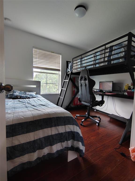 9871 Trumpet Vine Loop Trinity, FL 34655 - Photo 2 of 10 a bedroom with a bed and a window