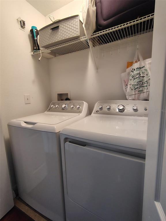 9871 Trumpet Vine Loop Trinity, FL 34655 - Photo 4 of 10 a utility room with dryer and washer