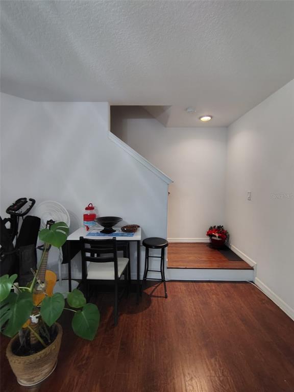 9871 Trumpet Vine Loop Trinity, FL 34655 - Photo 6 of 10 a living room with furniture and a wooden floor