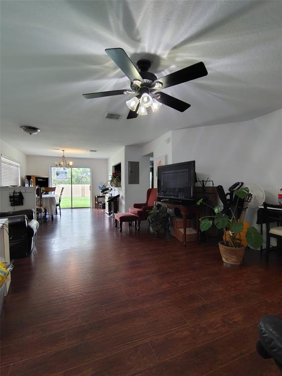 9871 Trumpet Vine Loop Trinity, FL 34655 - Photo 9 of 10 a living room with furniture and a flat screen tv