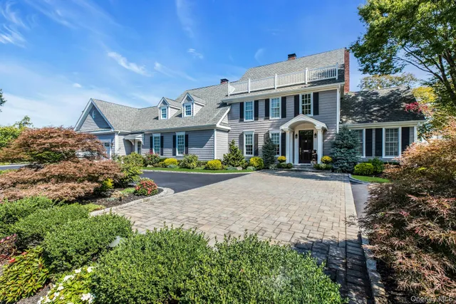 a front view of a residential apartment building with a yard