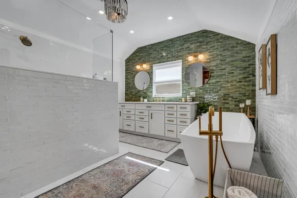 a white bath tub sitting in a bathroom