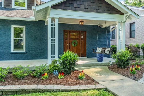 a front view of a house with a porch