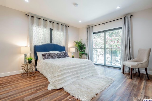 757 Cavanagh Road Glendale, CA 91207 - Photo 11 of 21 a spacious bedroom with a bed and wooden floor