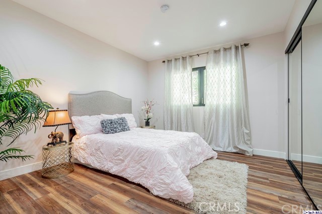 757 Cavanagh Road Glendale, CA 91207 - Photo 13 of 21 a bedroom with a bed and a potted plant