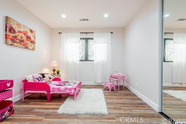 757 Cavanagh Road Glendale, CA 91207 - Photo 14 of 21 a bedroom with furniture and a wooden floor