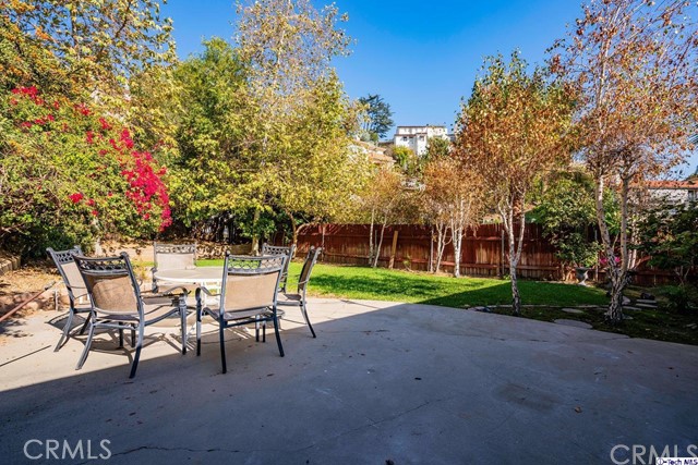 757 Cavanagh Road Glendale, CA 91207 - Photo 16 of 21 a backyard with a table and chairs