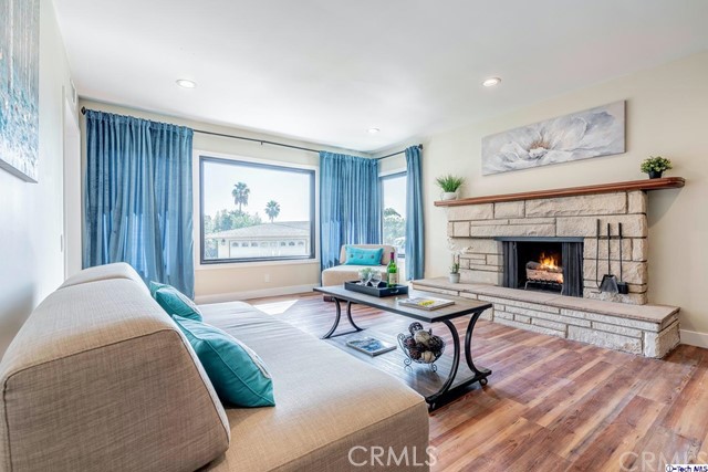 757 Cavanagh Road Glendale, CA 91207 - Photo 3 of 21 a living room with furniture and a fireplace