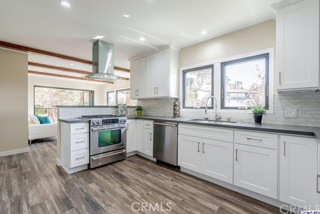757 Cavanagh Road Glendale, CA 91207 - Photo 5 of 21 a kitchen with granite countertop white cabinets a sink a window and appliances