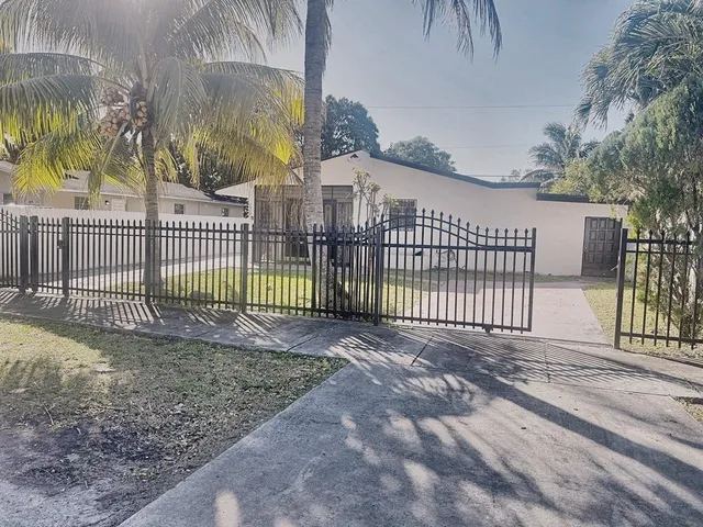 a view of a wrought iron fences in front of a house