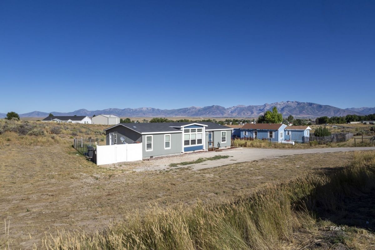 426 Spring Valley Parkway Spring Creek, NV 89815 - Photo 16 of 16 a view of residential houses with an outdoor space