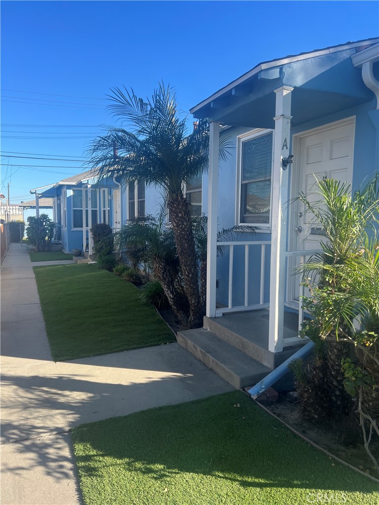 1750 Cabrillo Avenue Torrance, CA 90501 - Photo 1 of 25 a front view of a house with a yard
