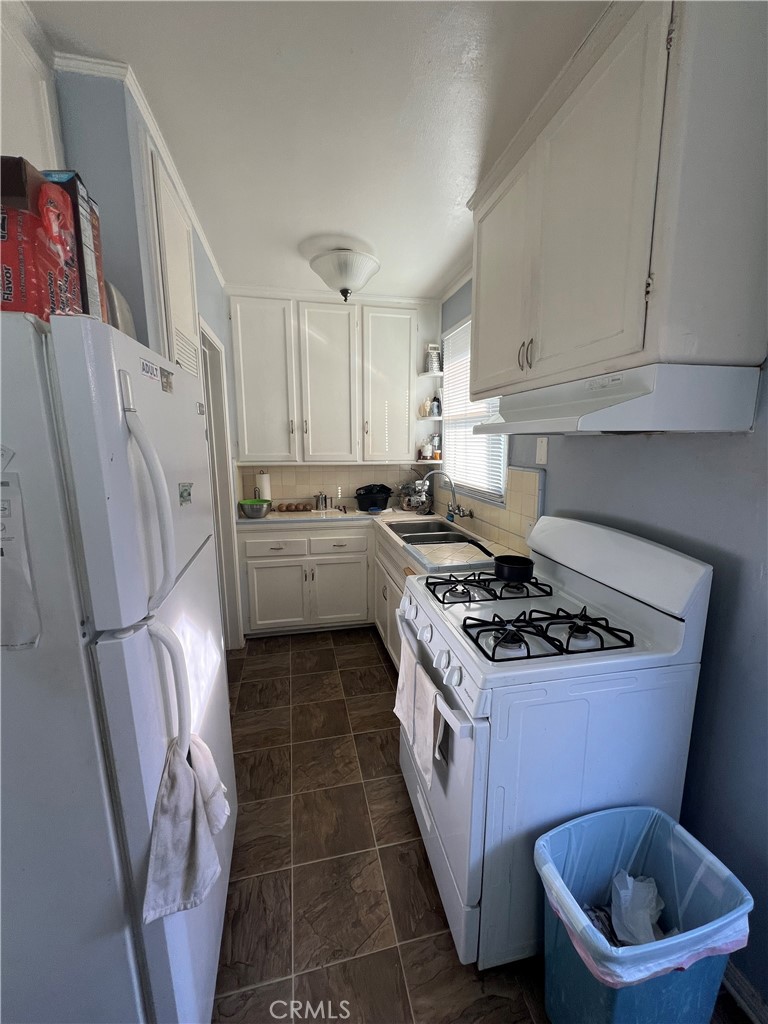 1750 Cabrillo Avenue Torrance, CA 90501 - Photo 12 of 25 a kitchen with a stove and a refrigerator