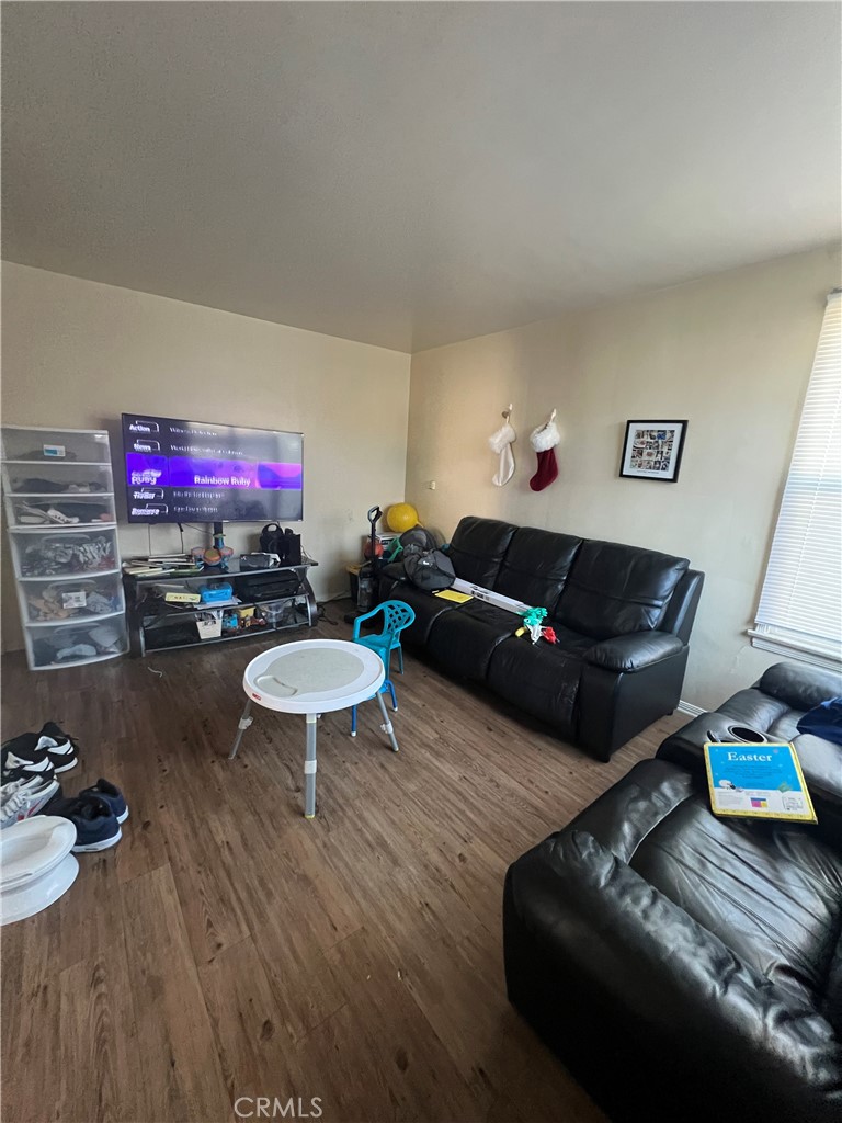 1750 Cabrillo Avenue Torrance, CA 90501 - Photo 20 of 25 a living room with furniture and a flat screen tv