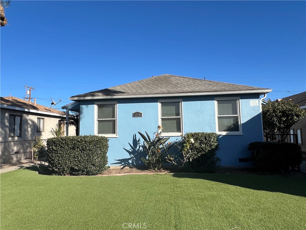 1750 Cabrillo Avenue Torrance, CA 90501 - Photo 2 of 25 a front view of a house with garden