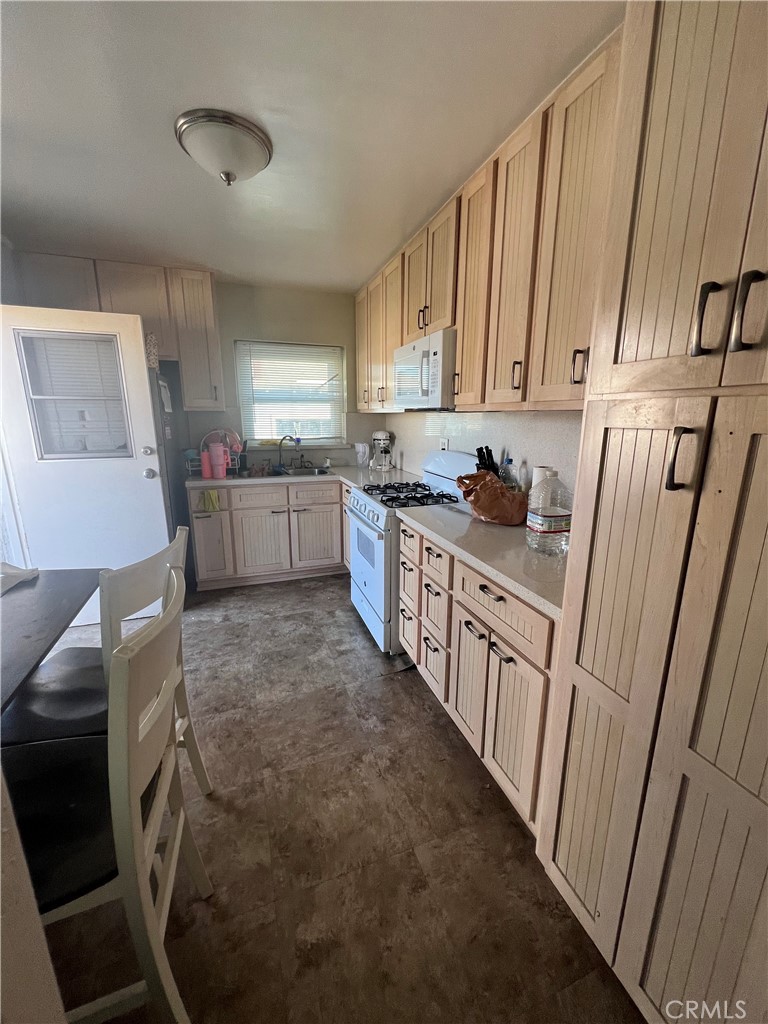 1750 Cabrillo Avenue Torrance, CA 90501 - Photo 21 of 25 a kitchen with sink cabinets and window