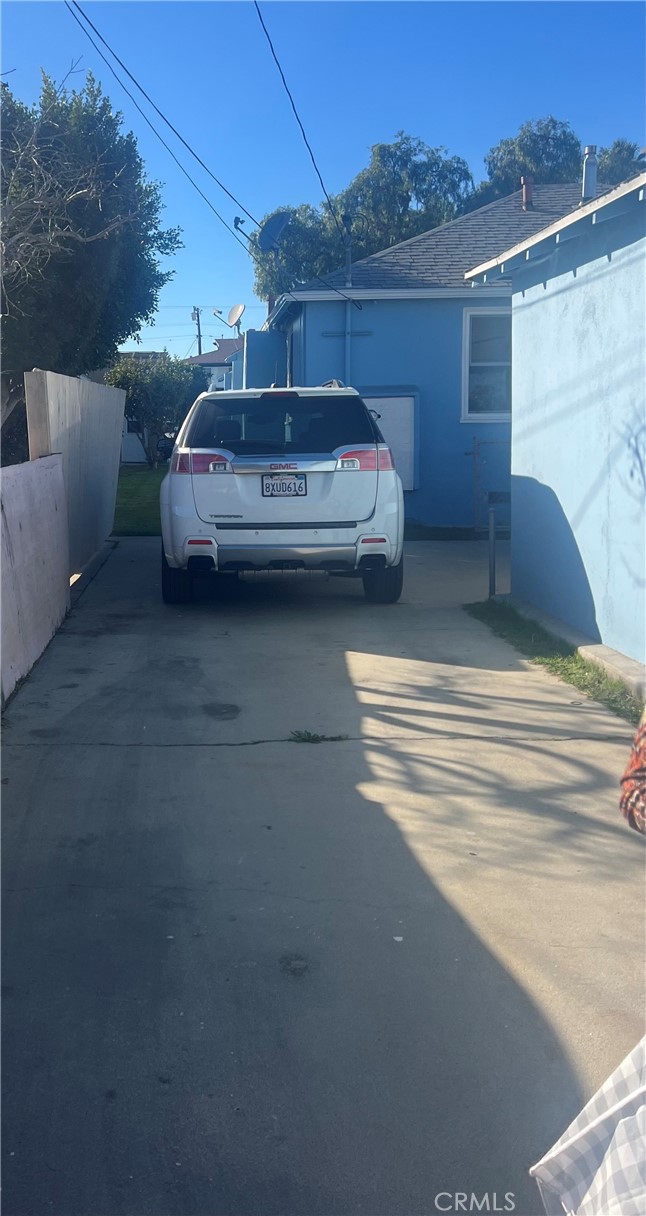 1750 Cabrillo Avenue Torrance, CA 90501 - Photo 7 of 25 a view of a car parked in back of a house