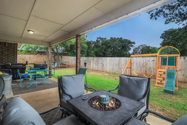 a view of a patio with couches chairs and a table