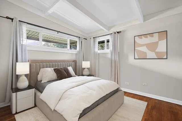 a bedroom with a large bed and a window