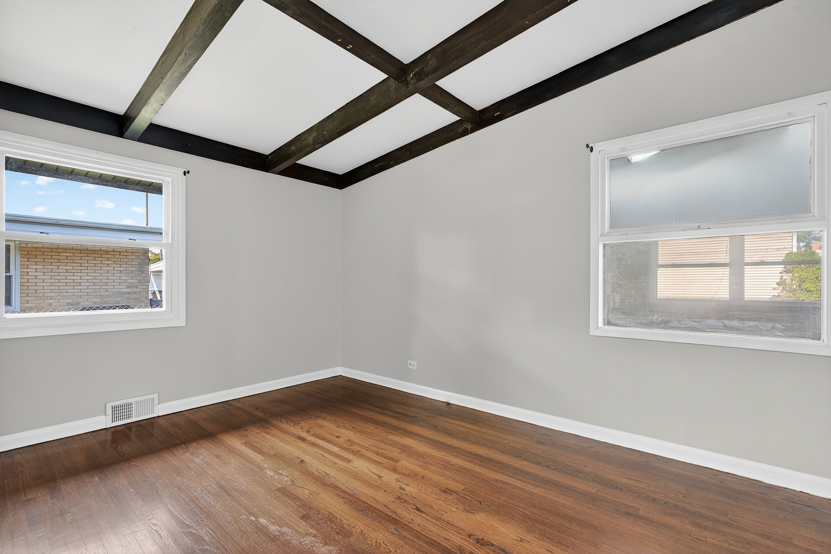 7818 West Argyle Street Norridge, IL 60706 - Photo 13 of 24 a view of an empty room with wooden floor and a window