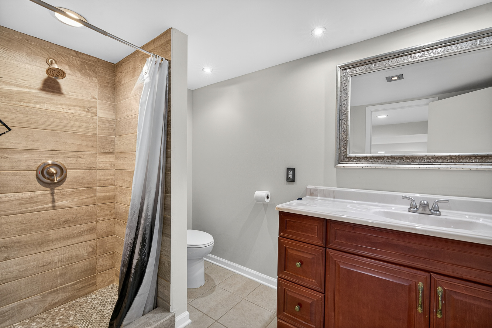 7818 West Argyle Street Norridge, IL 60706 - Photo 18 of 24 a bathroom with a sink a toilet and shower
