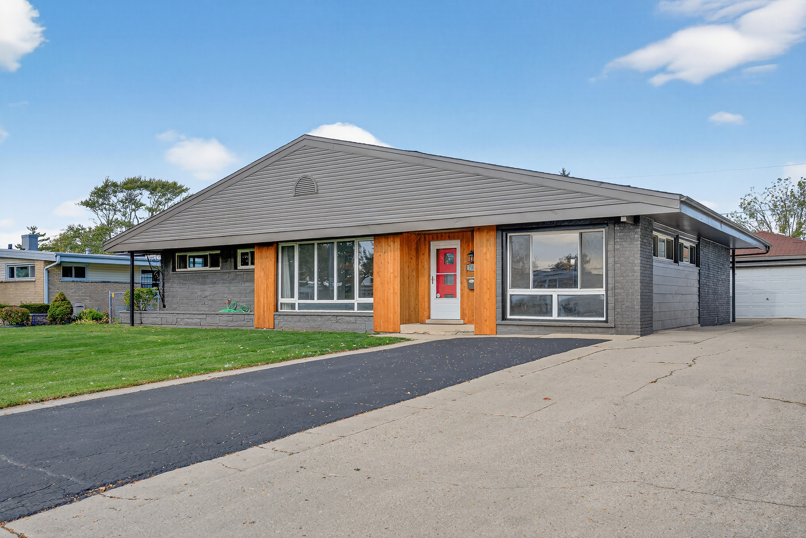 7818 West Argyle Street Norridge, IL 60706 - Photo 23 of 24 a front view of a house with a yard and garage