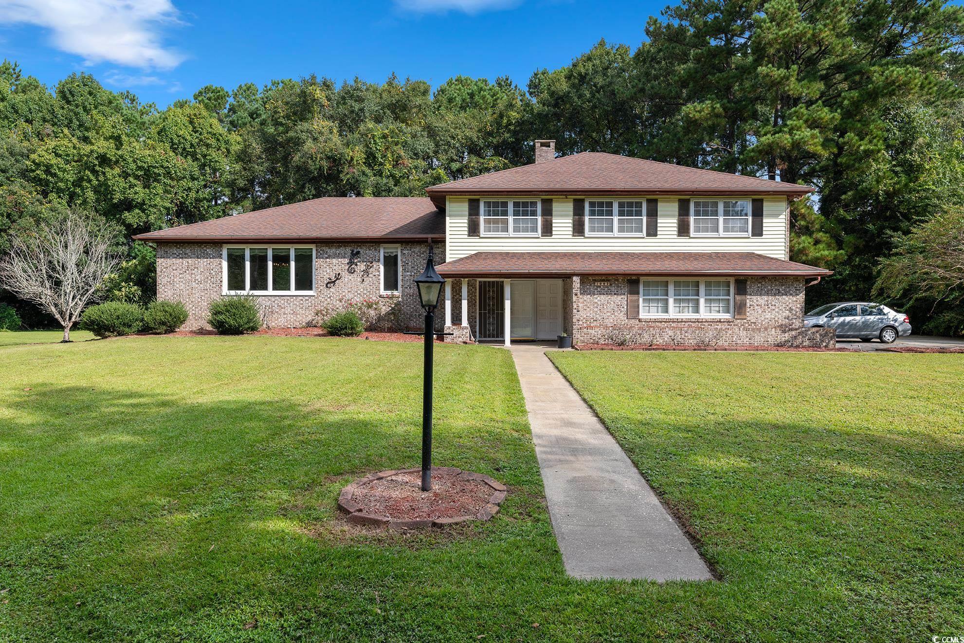 1002 Pyatt Street Georgetown, SC 29440 - Photo 1 of 30 Tri-level home featuring a front yard