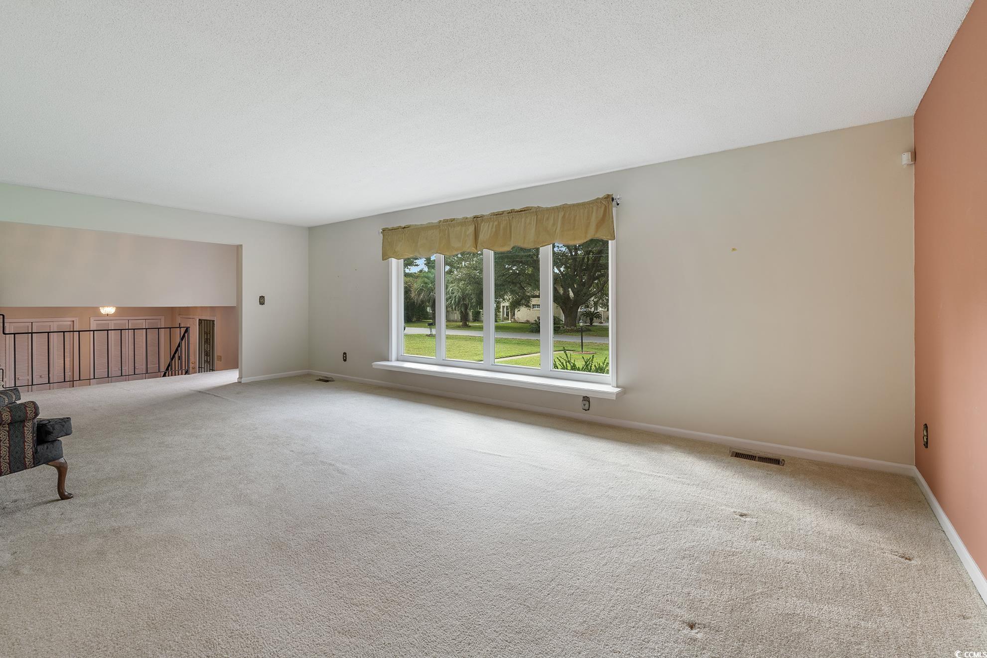 1002 Pyatt Street Georgetown, SC 29440 - Photo 23 of 30 living room with light colored carpet