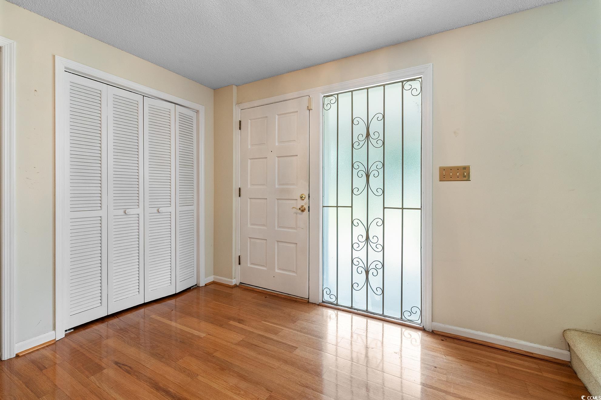 1002 Pyatt Street Georgetown, SC 29440 - Photo 7 of 30 Foyer entrance with a textured ceiling and light h