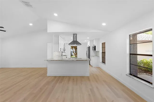 a outdoor space with patio the couches and a dining table with garden view