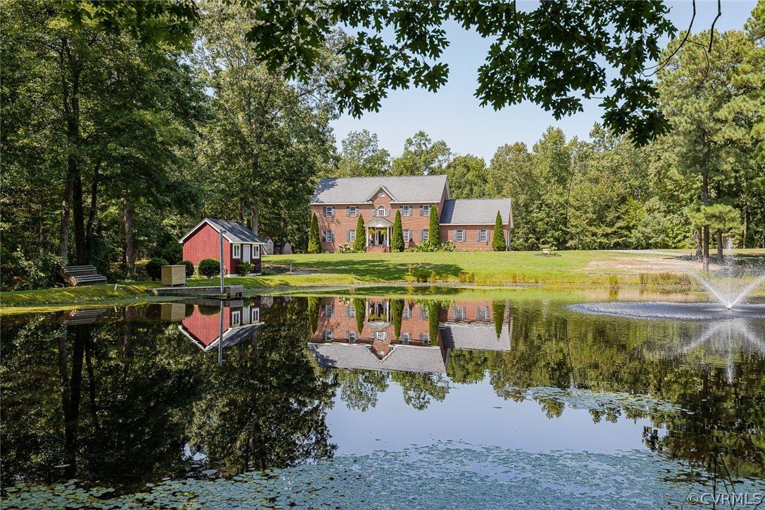 Beautiful ALL brick home overlooking pond