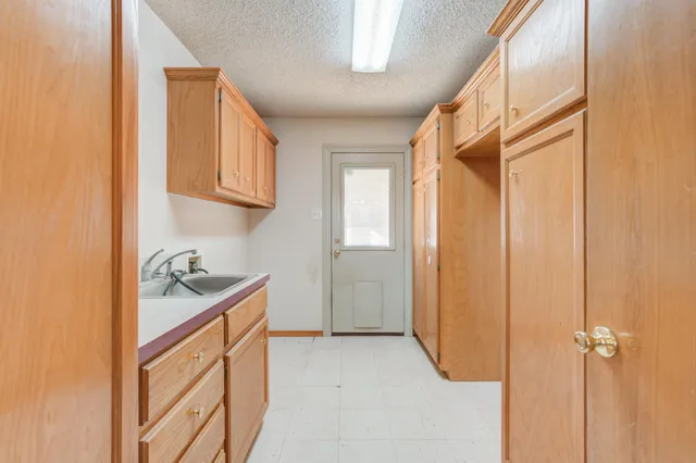 a utility room with cabinets