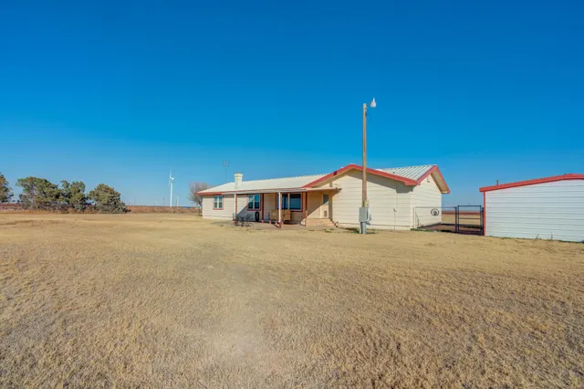 a house with trees in the background