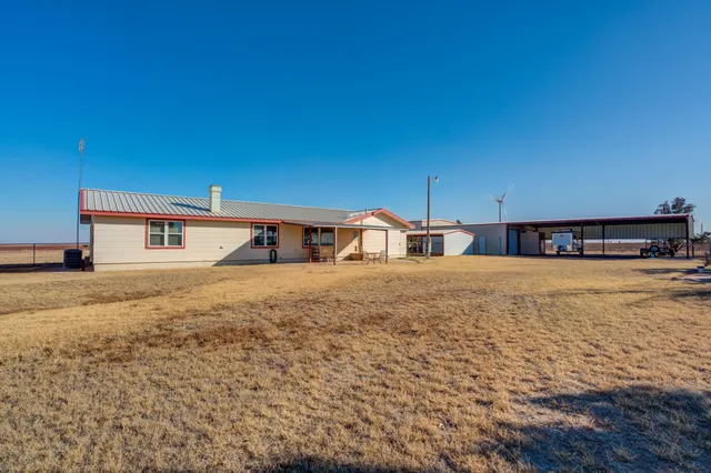a bedroom with a bed and a night stand