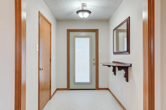 a view of a hallway with front door