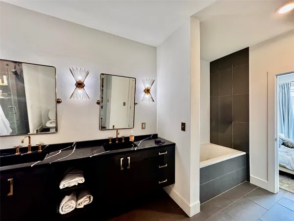 a bathroom with a bathtub and a sink